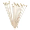 Kjærlighet på pinne med kule, i lyst tre. 20-pakning, lengde 16 cm