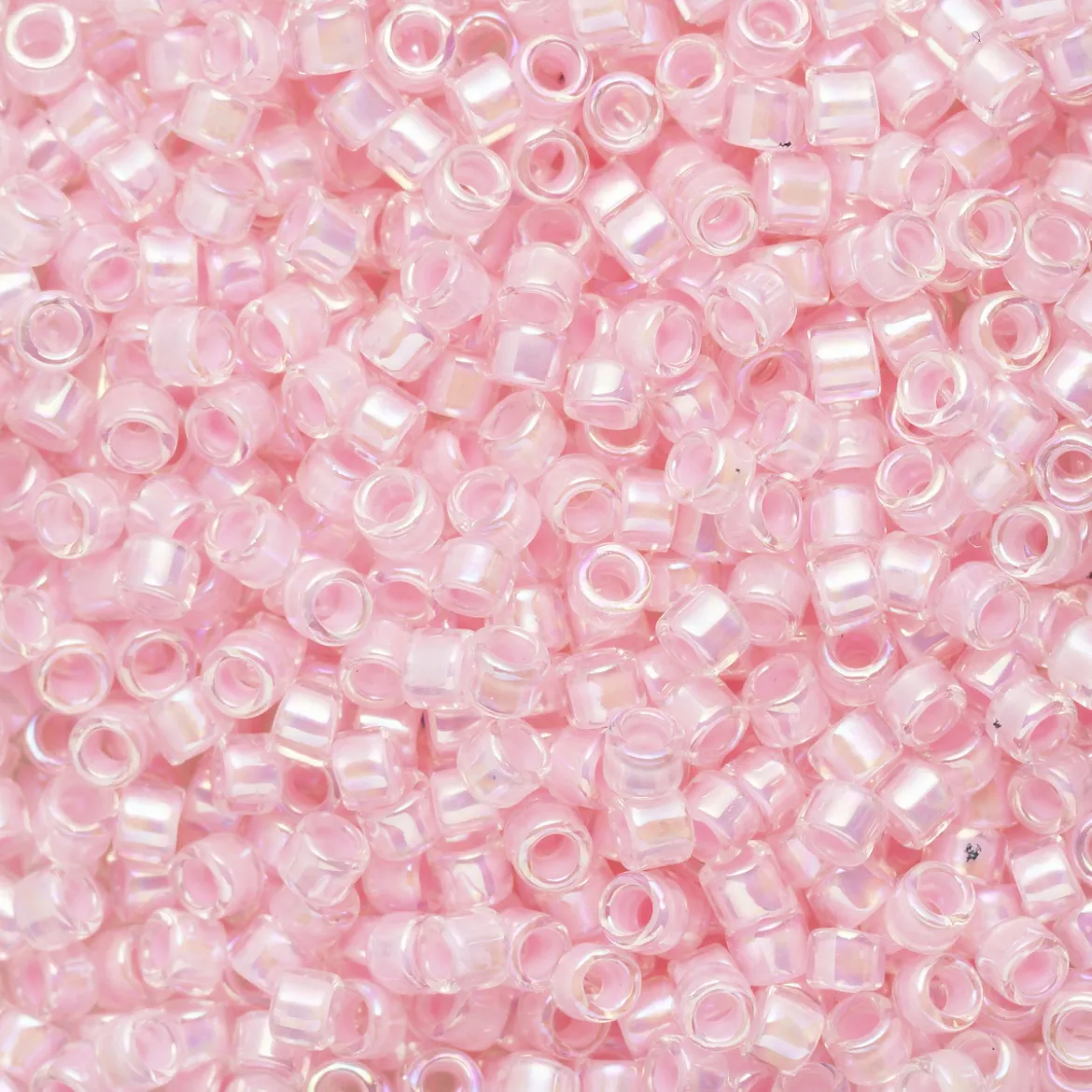 TOHO-perler 11/0 – lyserosa rainbow, 780 IC rainbow crystal/bubble gum-lined