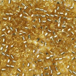 TOHO-perler runde 11/0 – klar topas, 22 Silver lined light topaz